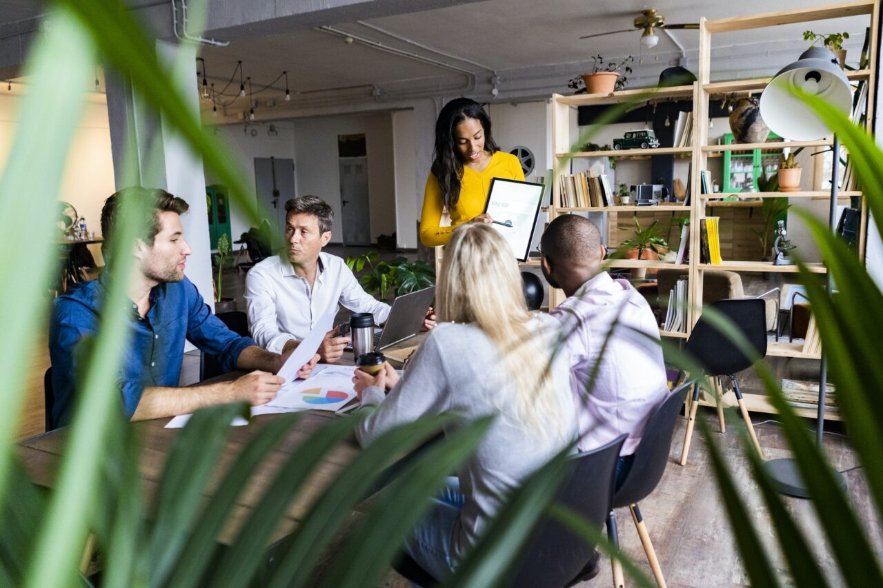 Businesswoman leading a presentation in loft office